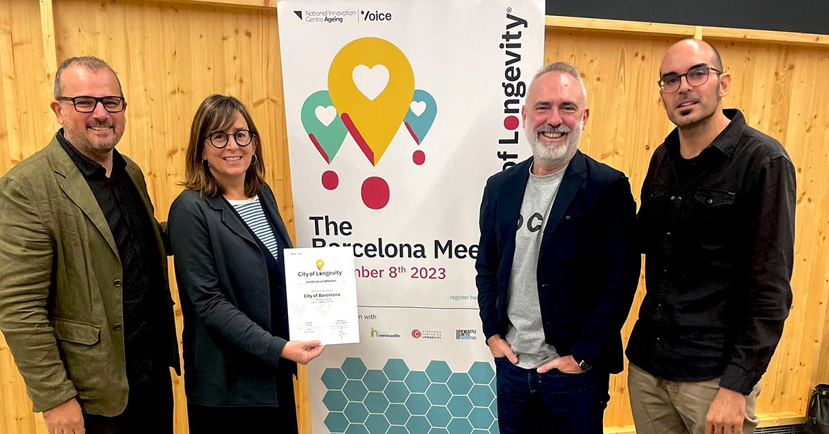 4 people smiling and facing the camera, holding a certificate stating Certificate of Affirmation for the City of Barcelona